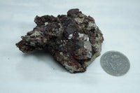 Calcite coated with hematite and goethite, from the Faraday Uranium mine, circa 1957.