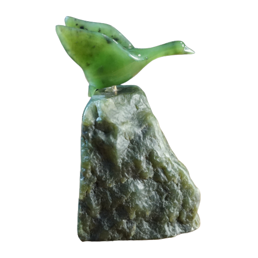 Jade Goose flying on a rock